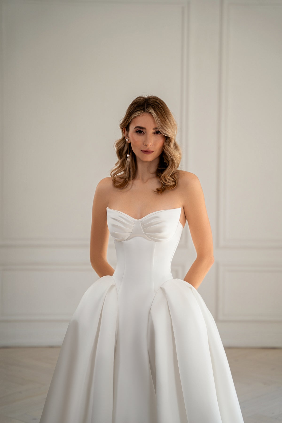Bride in strapless ball gown wedding dress with sweetheart neckline,