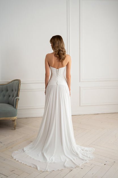 Corset lace-up back detail on strapless chiffon wedding dress"